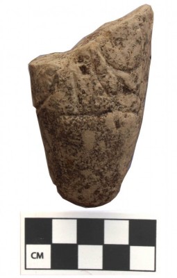Figure 5. Broken Yarmoukian pebble figurine from WQ117.